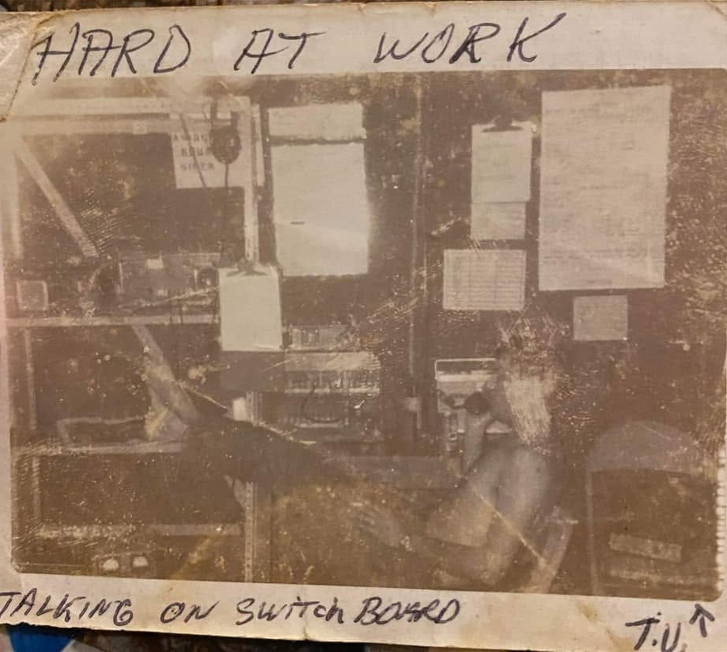 Before: the same photo, faded and damaged, with handwriting on the print
